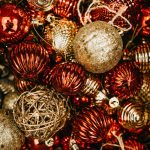 shallow focus photo of gold and red Christmas baubles