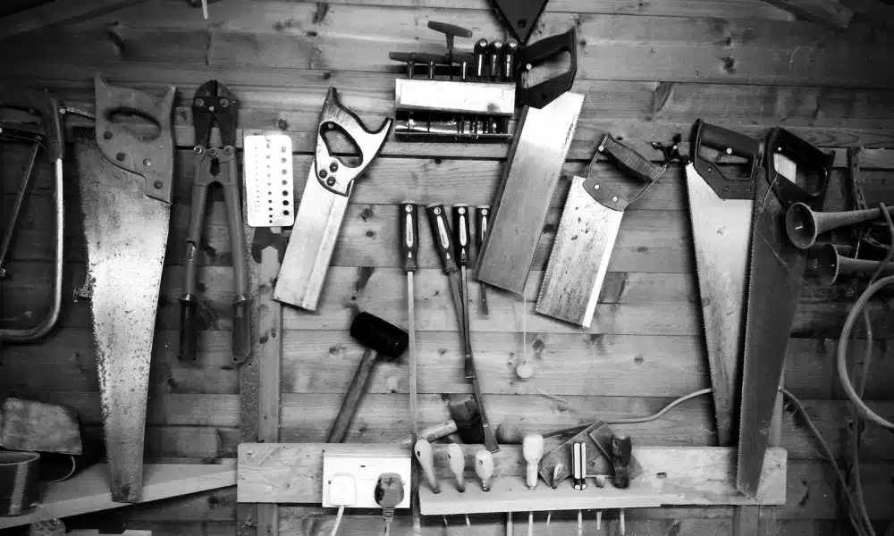 grayscale photography of arranged assorted hand tools