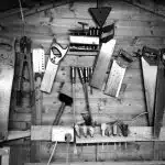 grayscale photography of arranged assorted hand tools